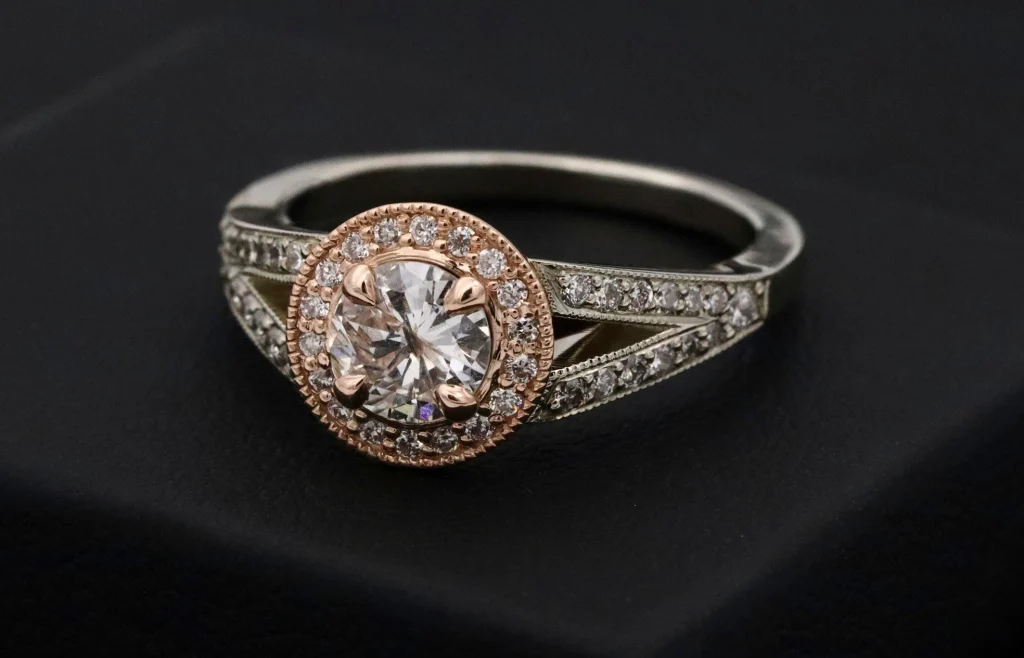 High-fashion emerald engagement ring with halo diamonds